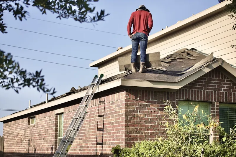 Professional roofer working on a residential roof in Hawkins Estates